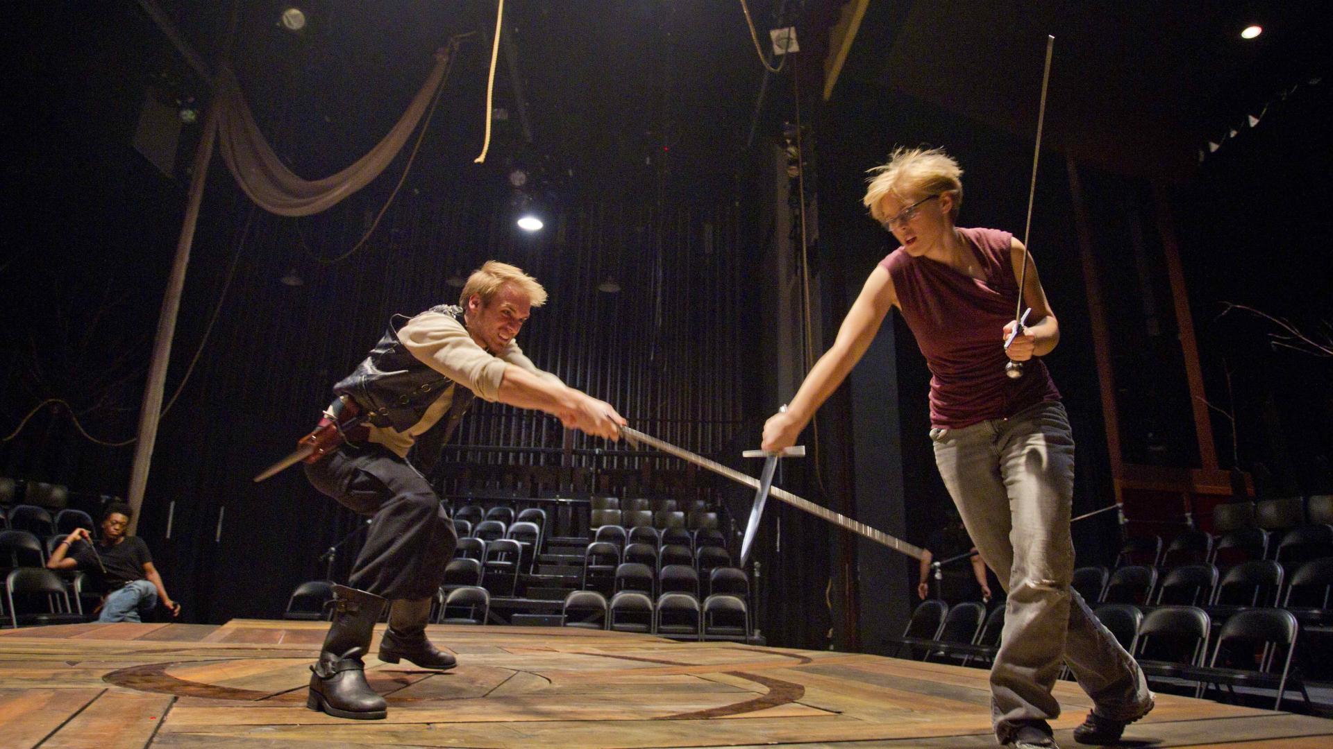 Sword fighting in Shakespeare performance for theatre and dance (Performance, Production & Community) major at Hamline 