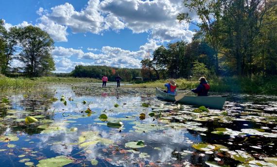Canoes heading ashore at the Teacher Field School