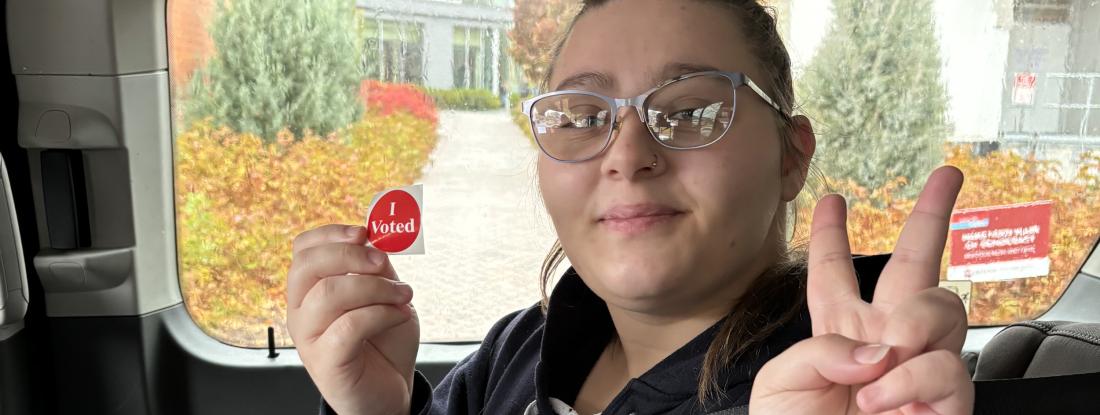 Hamline student with I Voted sticker