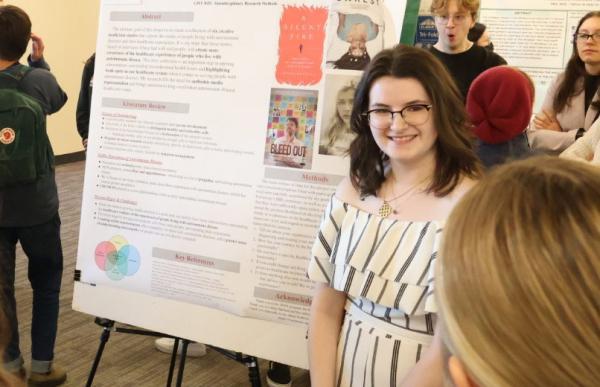 Student presenting work at the Hamline Student Research Spring Showcase and Symposium